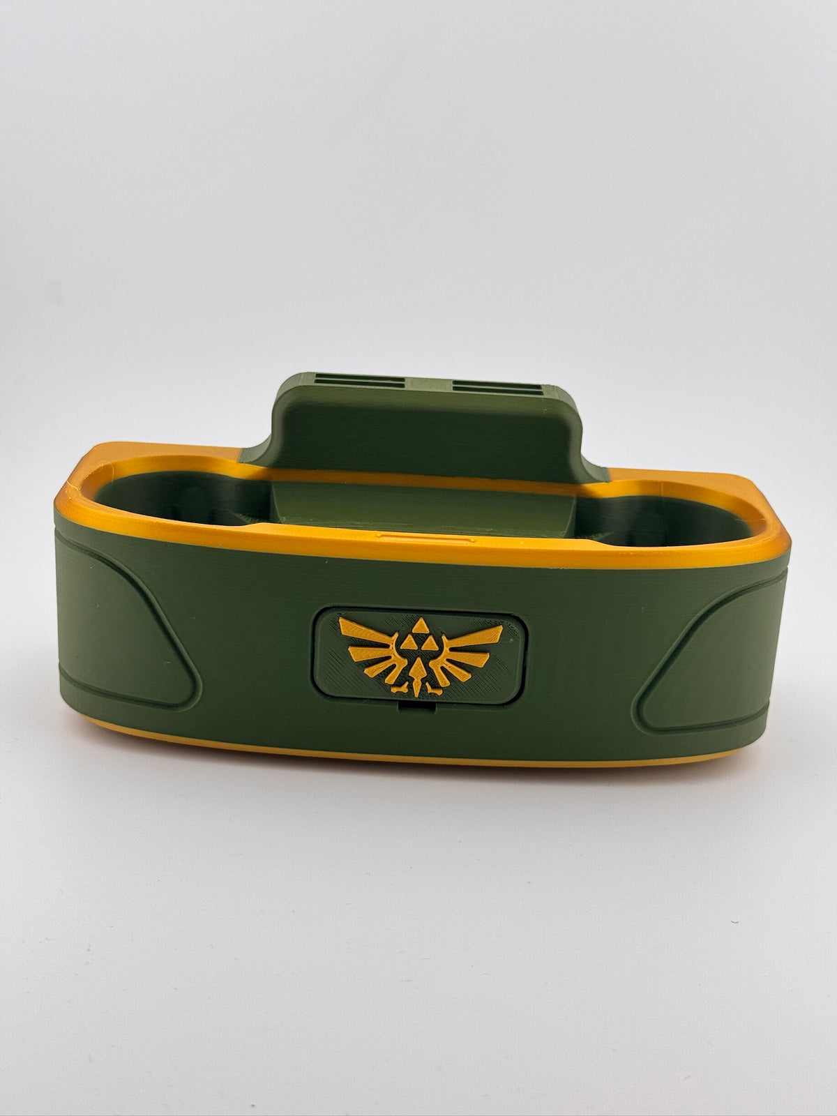 Actual green and gold dock with winged crest faceplate