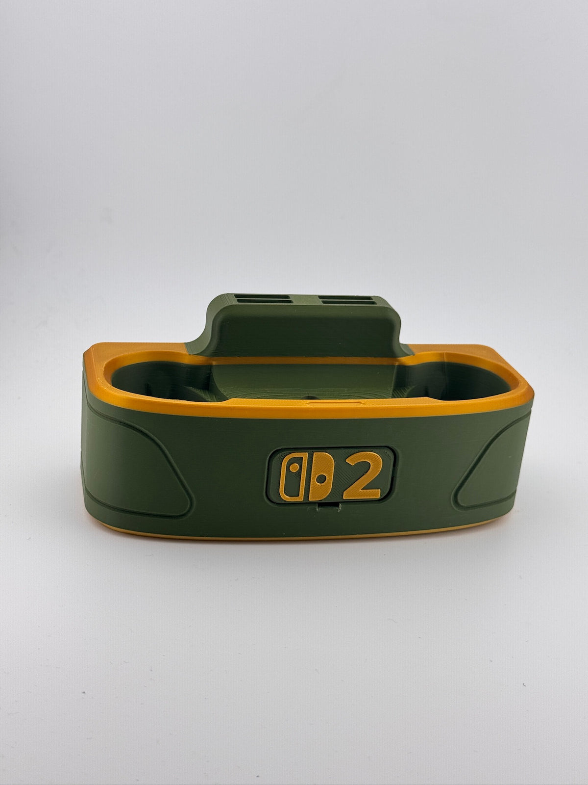 Actual olive green and gold dock with Switch 2 faceplate