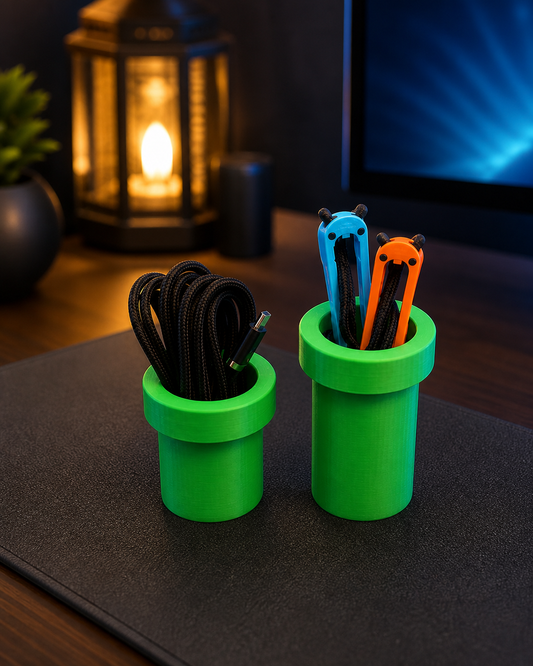 Short and tall green pixel-style pipe organizers fully visible on a gaming desk